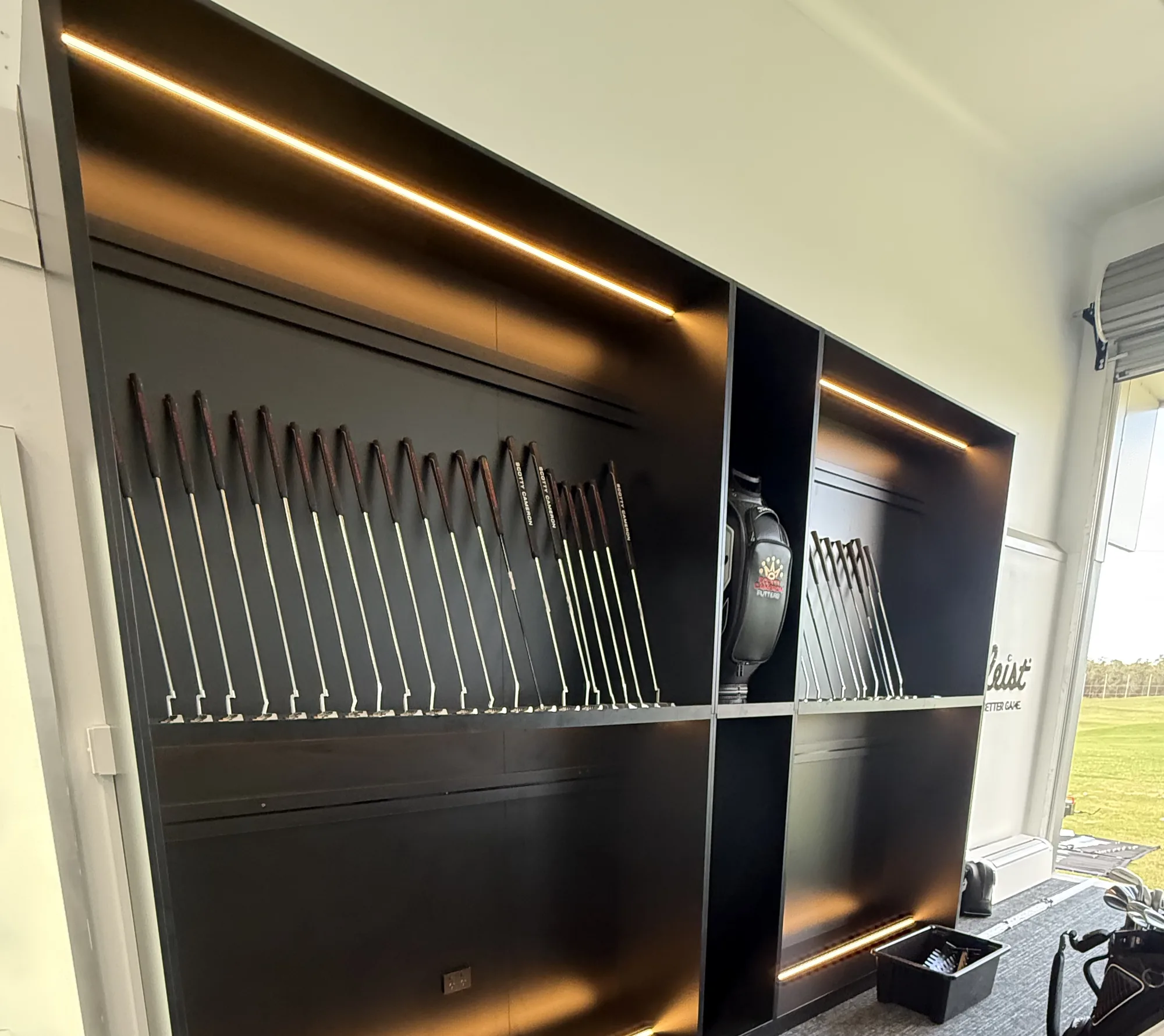 Feature LED display lighting in a golf pro shop fit-out by Wire & Watt, Brisbane