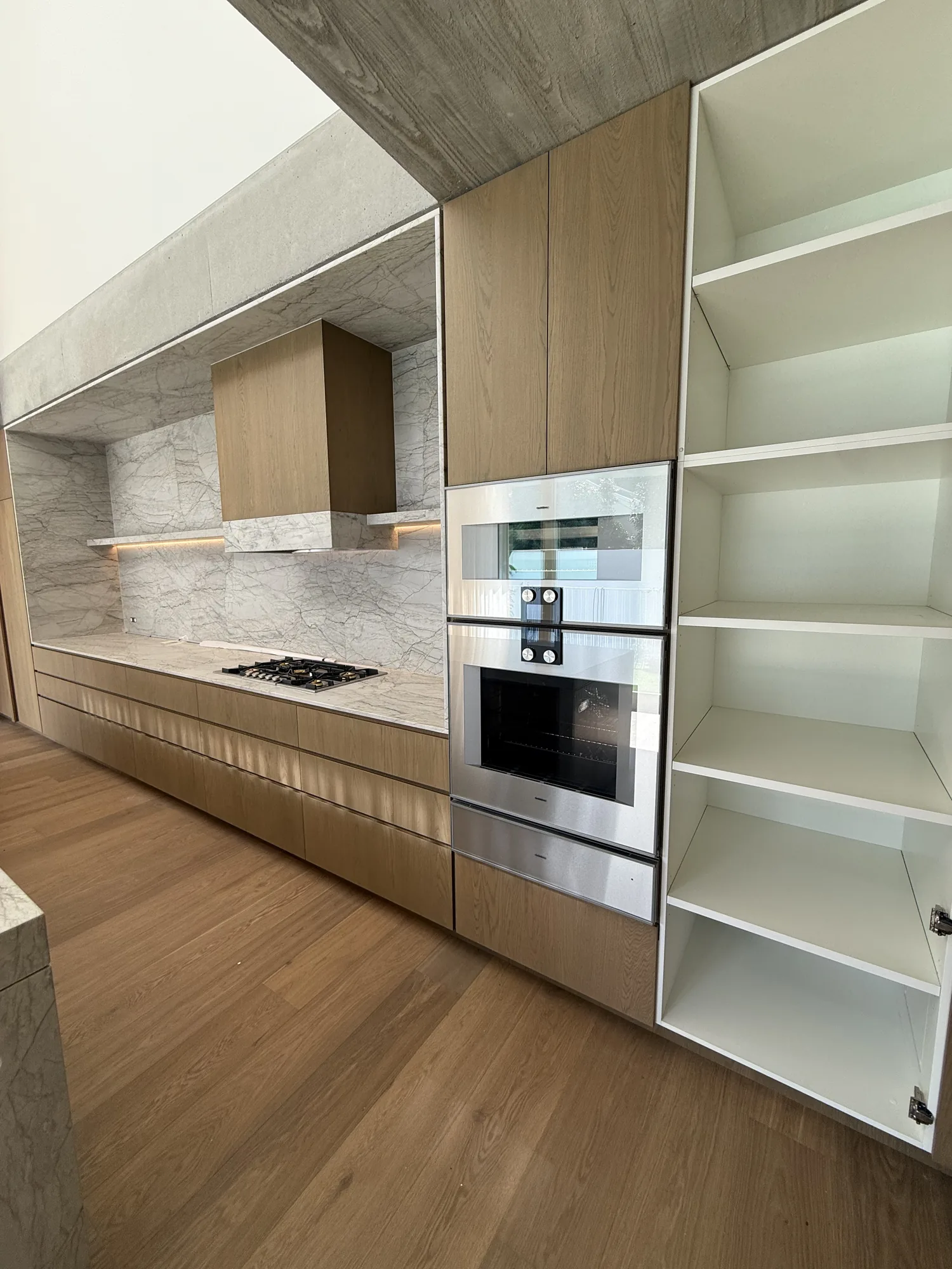 Kitchen cooktop and integrated appliance installation by Wire & Watt, Brisbane